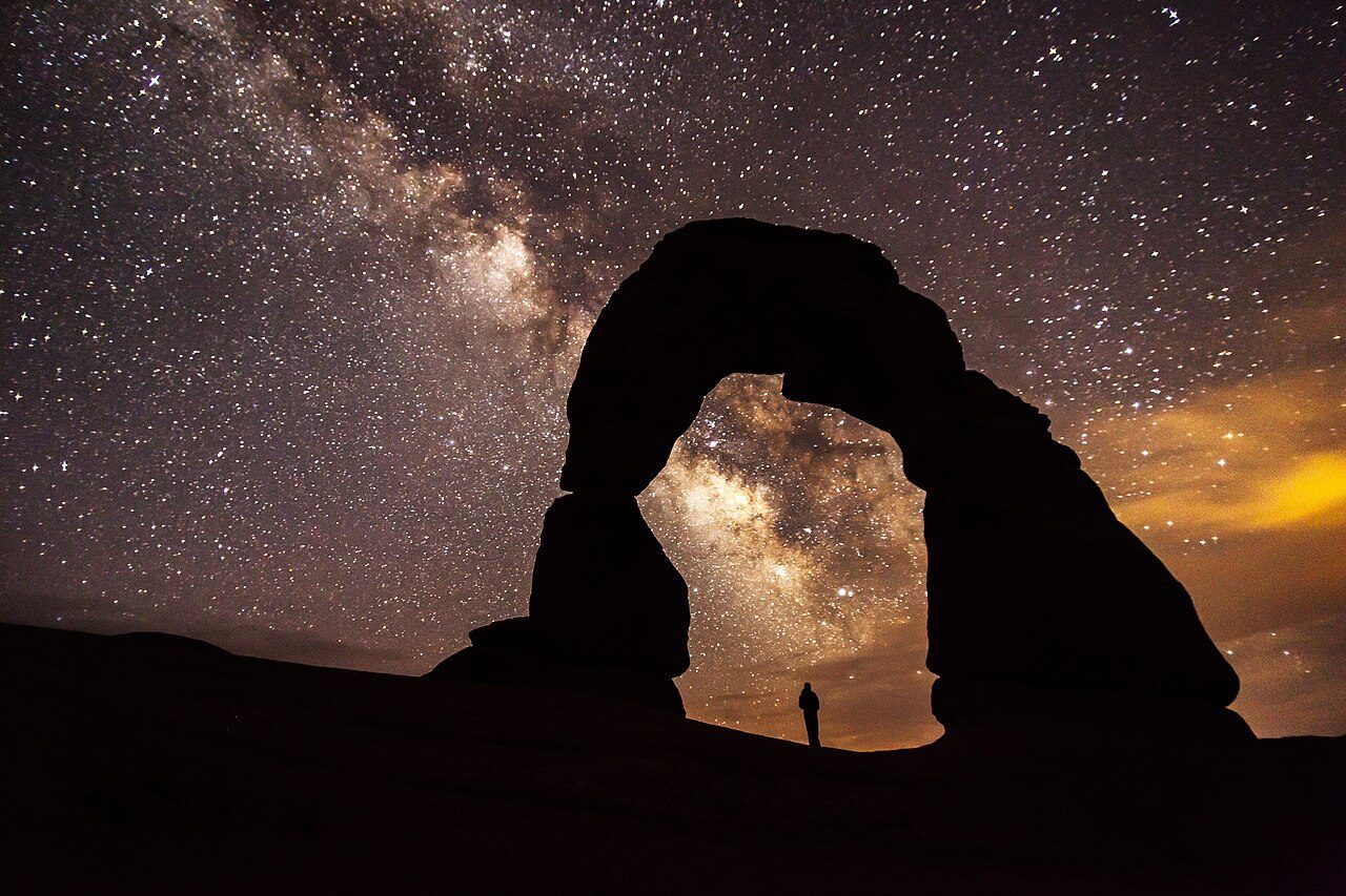 Delicate Arch under the Milky Way in Arches National Park &mdash; the certified dark-sky parks of the American West keep skies like this within a day&rsquo;s drive of most of the country