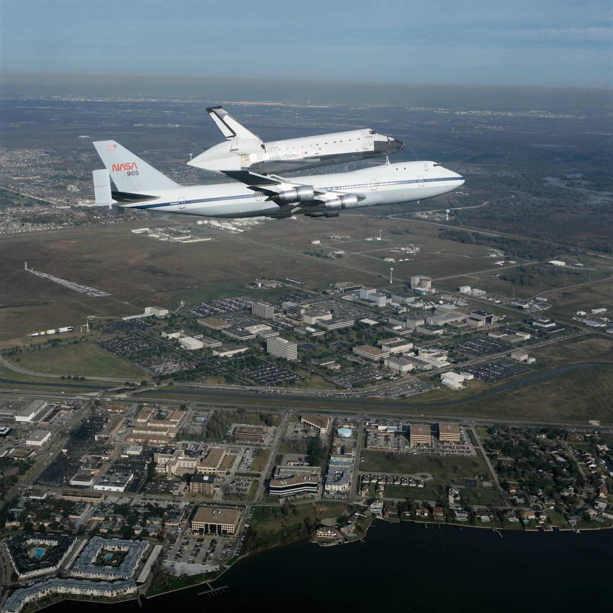 Space shuttle Columbia riding on the NASA 905 Boeing 747 over the Johnson Space Center campus in Houston in 1990