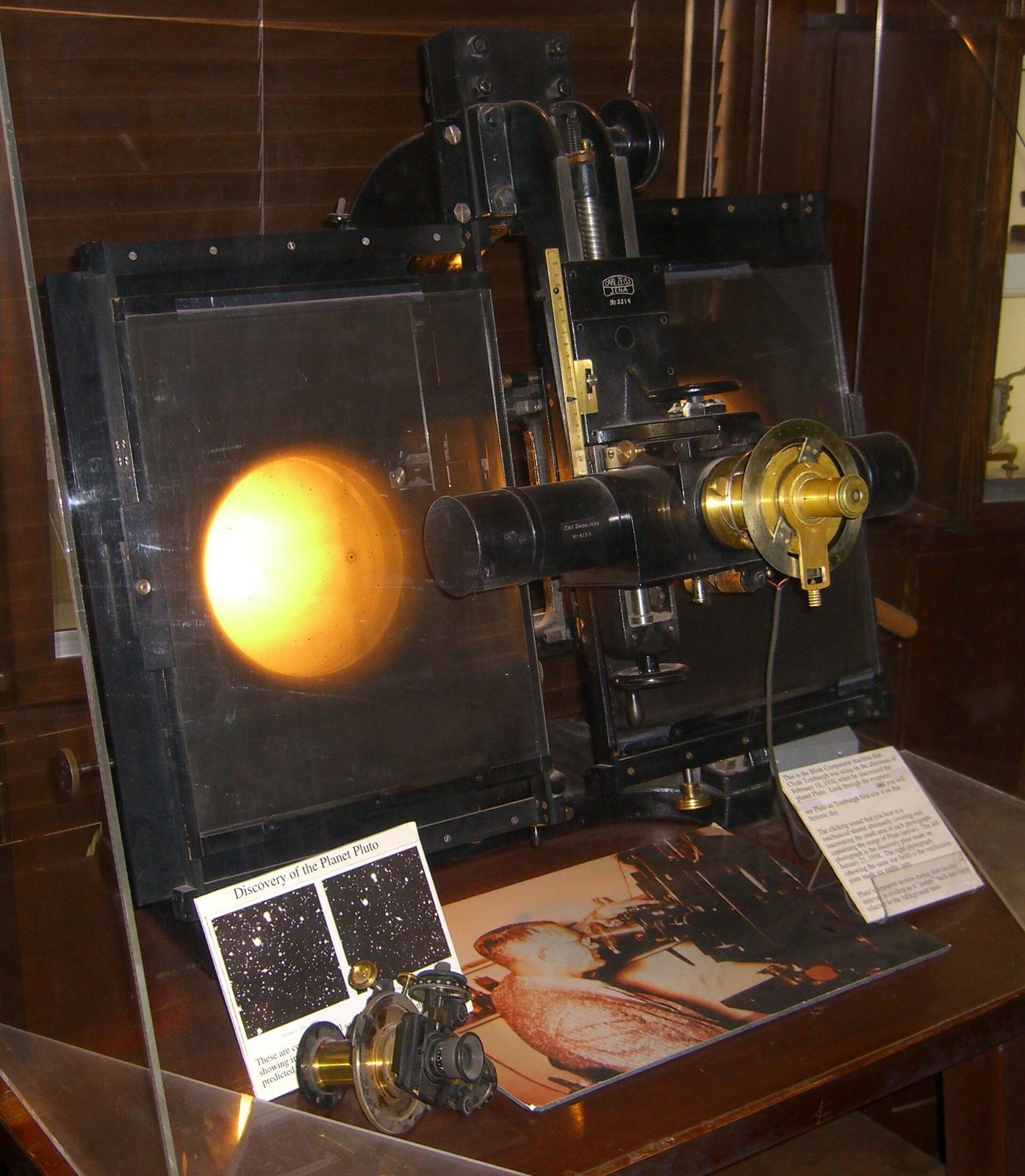 The Carl Zeiss Jena blink comparator on display at Lowell Observatory, its two glass-plate holders side by side &mdash; the machine Clyde Tombaugh used to flip between two photographic plates until one faint point of light jumped