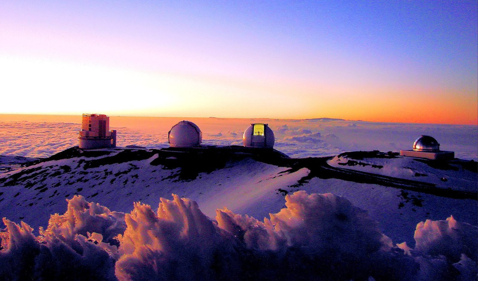 Sunset over the telescopes of the Mauna Kea Observatories in Hawaii, on the 13,800-foot summit that ranks among the best stargazing sites on Earth