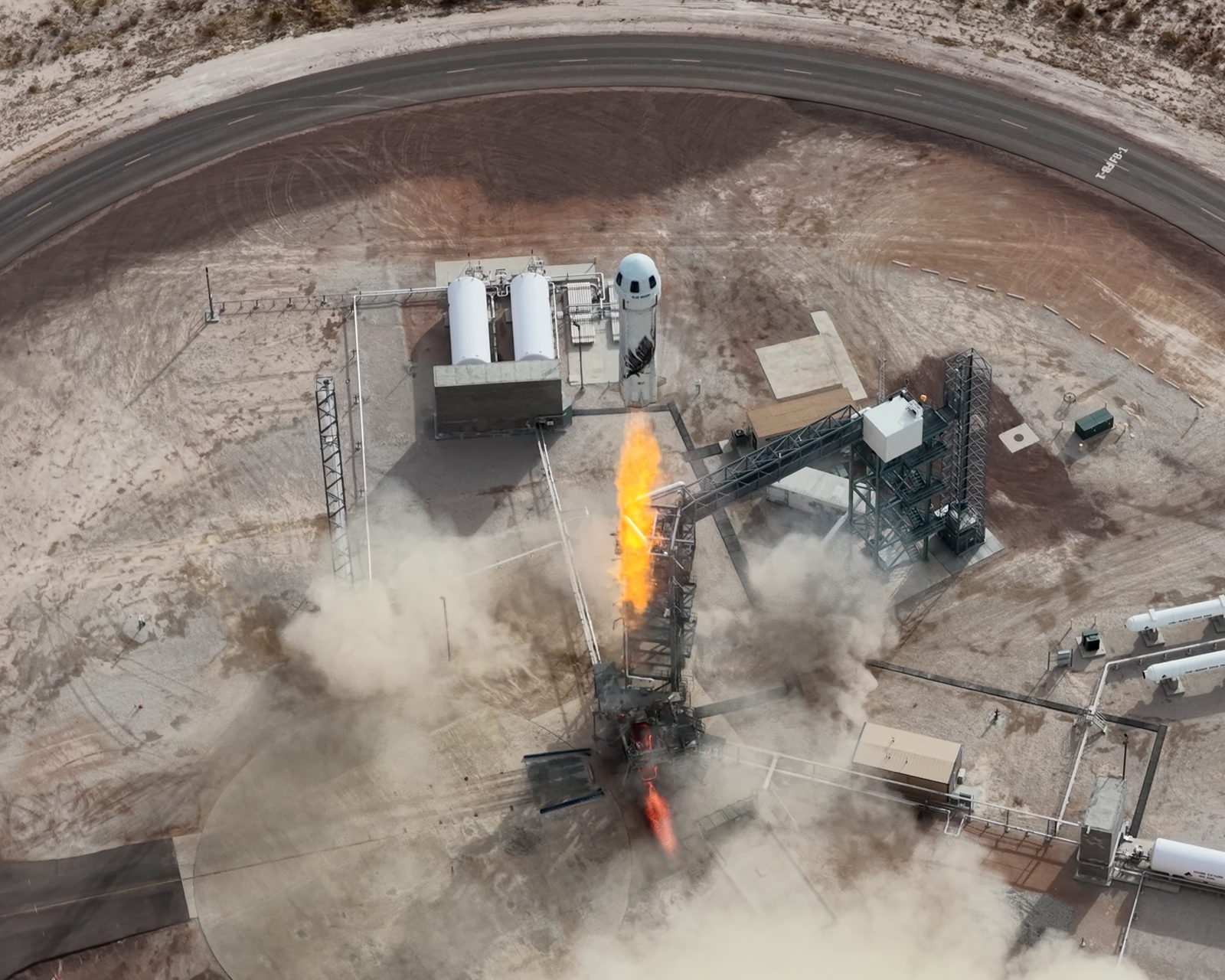 Blue Origin’s New Shepard rocket lifting off from its West Texas launch tower