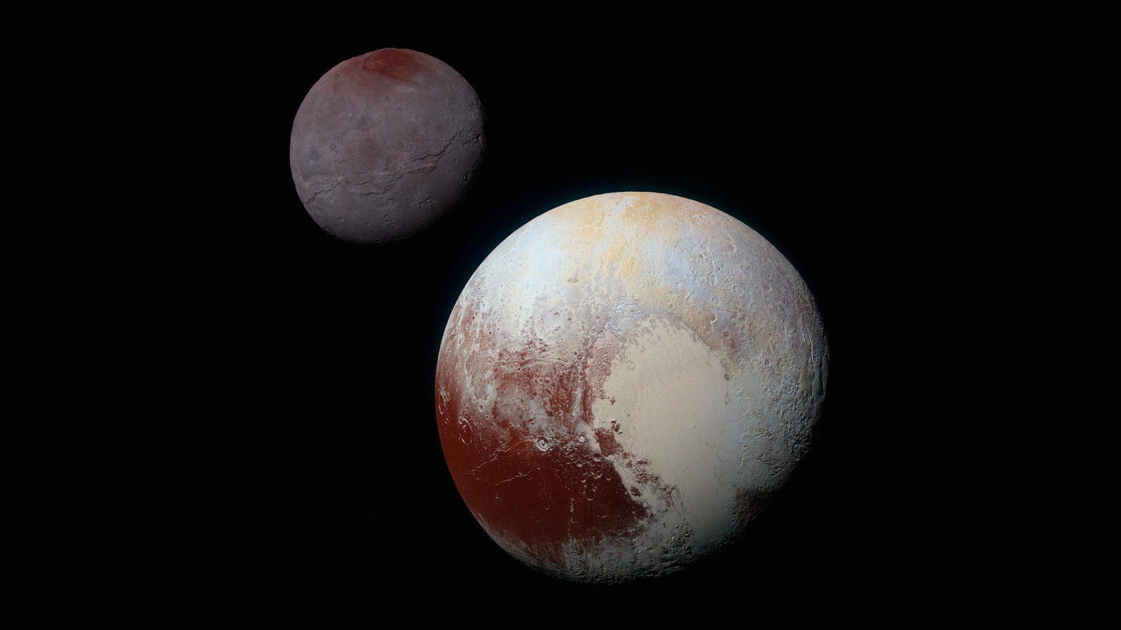 Pluto and its moon Charon in color, as NASA&rsquo;s New Horizons saw them in 2015 &mdash; the world Clyde Tombaugh found in 1930 as a faint dot that moved