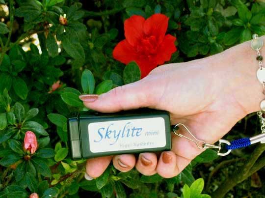 Rigel Systems Skylite Mini astronomy flashlight held in a hand, showing its pocket size