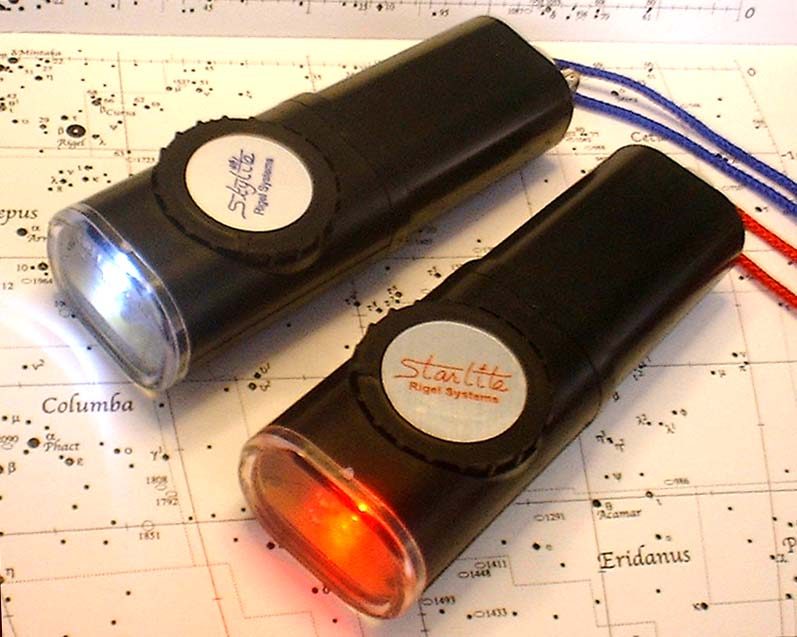 Rigel Systems Starlite and Skylite Water Resistant astronomy flashlights on a star chart, red and white LEDs lit