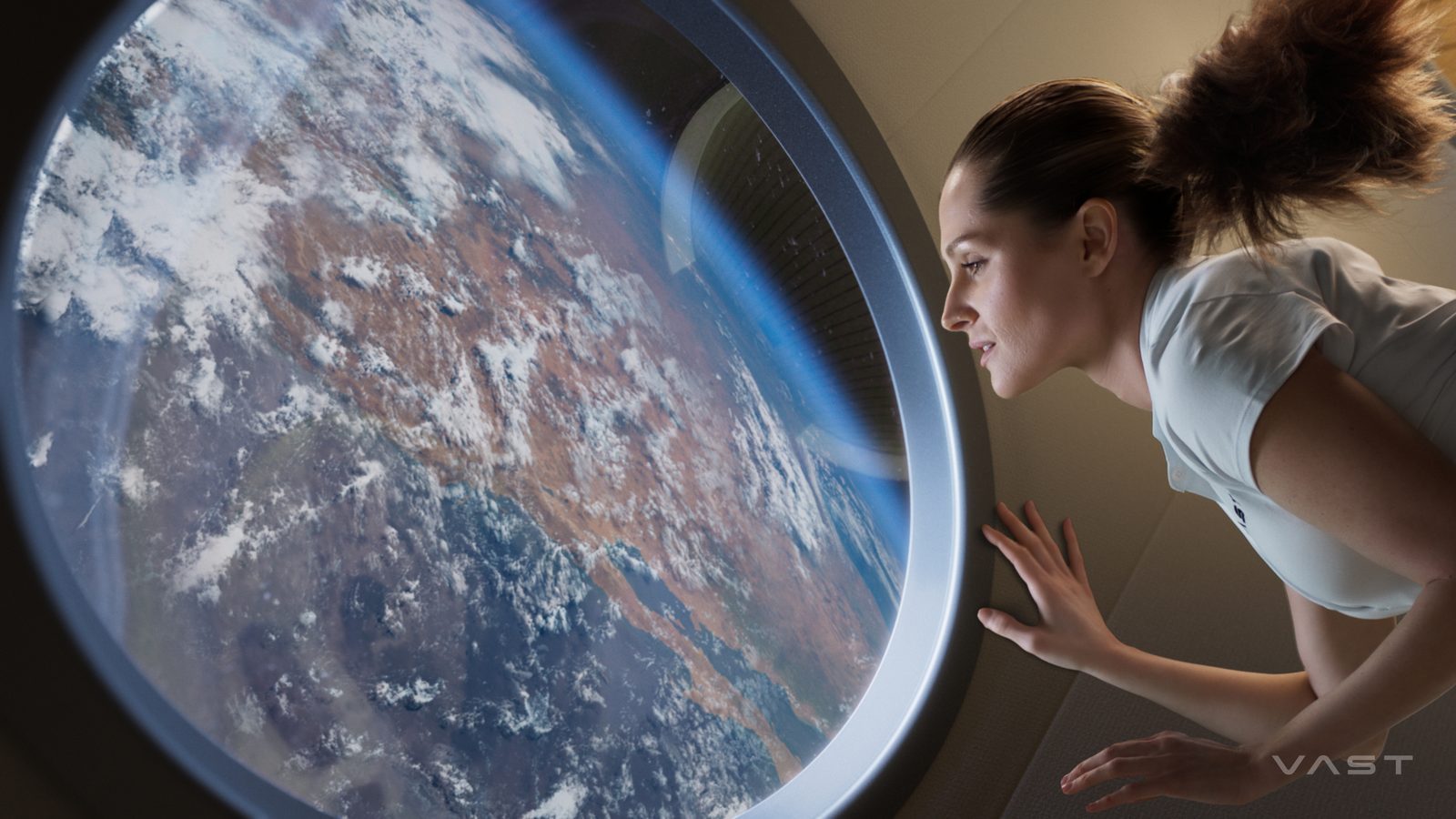 A crew member gazes at Earth through the domed observation window on Vast’s Haven-1 station